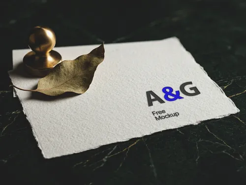 Free Logo Mockup On Torn Edge Paper — Dark Marble Luxury Scene (PSD) mockup preview