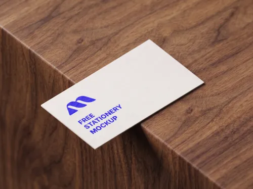 Free Business Card Mockup On Walnut Wood Edge — Warm Close Up (PSD) mockup preview