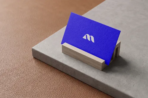 Free Business Card Mockup In Wooden Holder On Concrete — Leather Desk (PSD) mockup preview