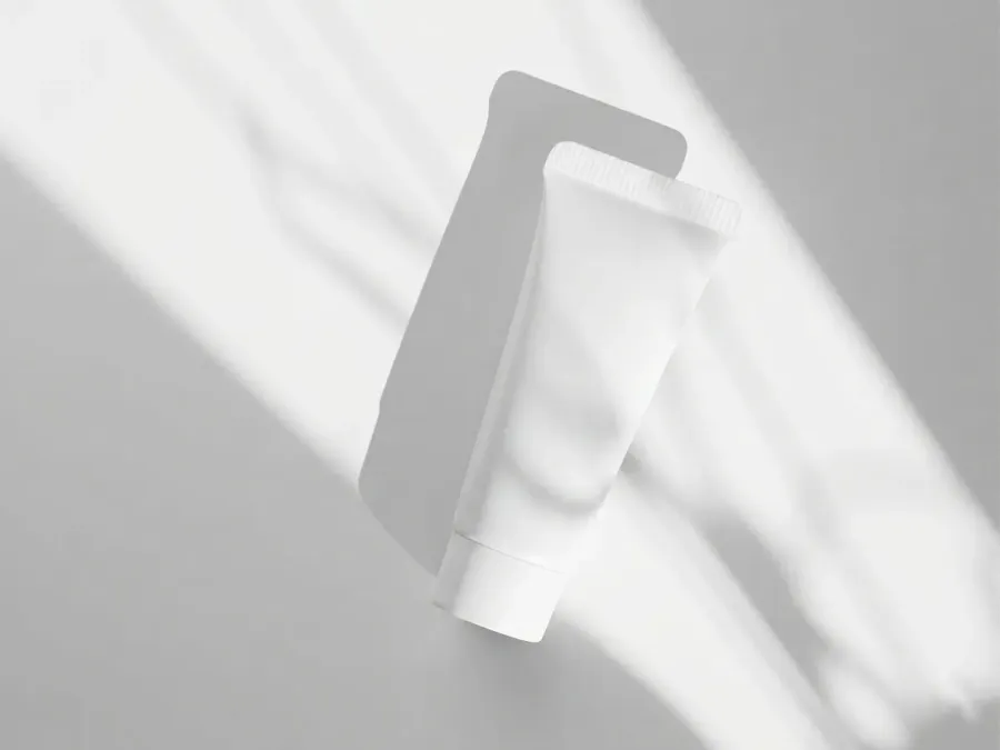 FREE FACE WASH TUBE MOCKUP WITH SHADOW SILHOUETTE — SUNLIT GREY (PSD) mockup preview 2