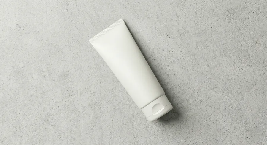 FREE FACE WASH TUBE MOCKUP FLAT LAY DIAGONAL — OVERHEAD VIEW (PSD) mockup preview 4