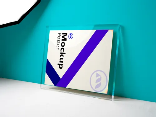 Free Acrylic Block Poster Mockup Leaning On Teal Wall — Landscape (PSD) mockup preview
