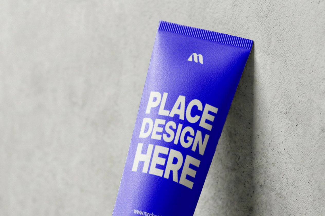 FREE FACE WASH TUBE MOCKUP LEANING AGAINST CONCRETE WALL (PSD) mockup preview 2