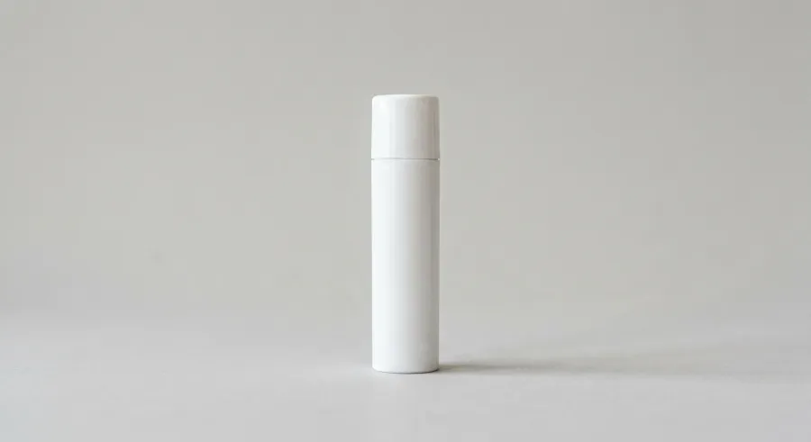 FREE LIP BALM TUBE MOCKUP STANDING UPRIGHT — STUDIO (PSD) mockup preview 2