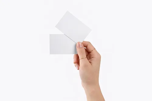 Free Dual Business Card Mockup Held In Hand — Minimal White Studio (PSD) alternate mockup preview