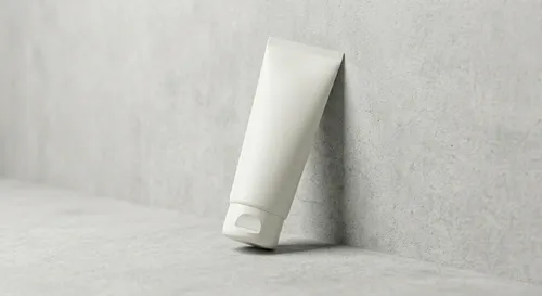 Free Face Wash Tube Mockup Leaning Against Concrete Wall (PSD) alternate mockup preview