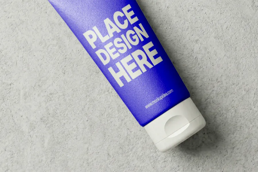 FREE FACE WASH TUBE MOCKUP FLAT LAY DIAGONAL — OVERHEAD VIEW (PSD) mockup preview 2