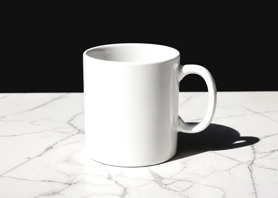 FREE TWO-TONE COFFEE MUG MOCKUP ON MARBLE — HARD SHADOW (PSD) mockup preview 2